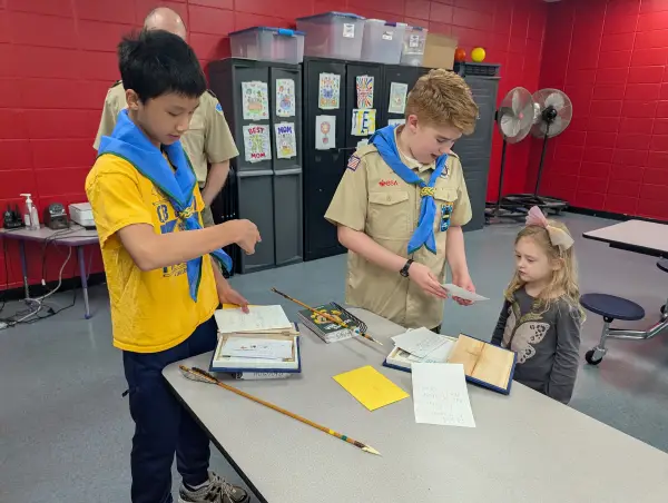 Arrow of Light Scouts at a den meeting