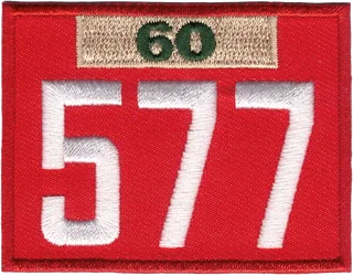 The Pack 577 unit number patch with its 60-year veteran bar